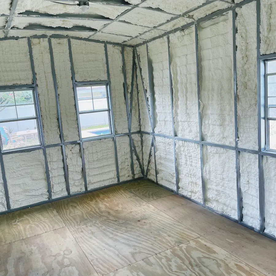 Closed-cell spray foam insulation applied to wall cavities in a residential project in Preston